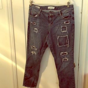 Square ripped blue jeans